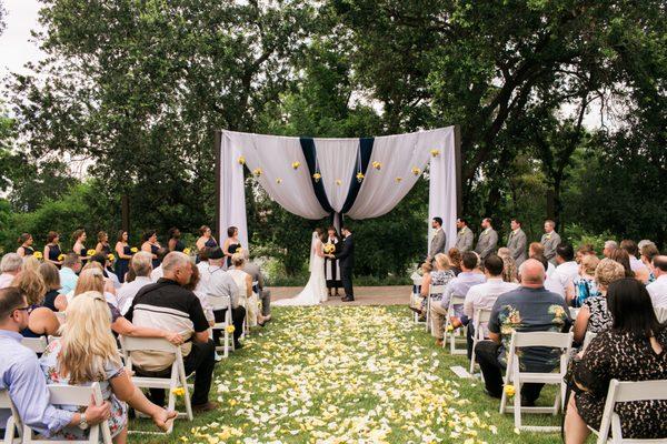 Beautiful outdoor Navy Blue, White and yellow wedding in June of 2016.  We were the wedding planners and the decorators.