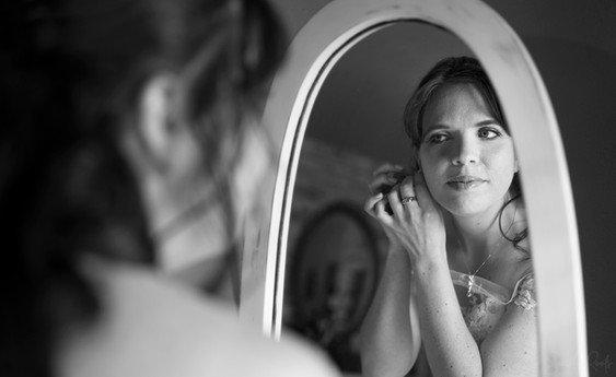 Bride preparations in the mirror.