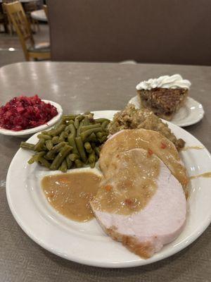 Cranberry relish, turkey, dressing, green beans, and pecan pie with whipped cream.