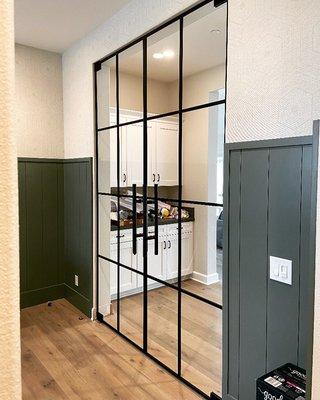 Matte black metal double doors with Starphire glass