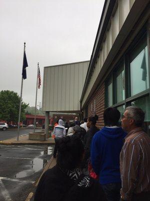 Line outside in the rain