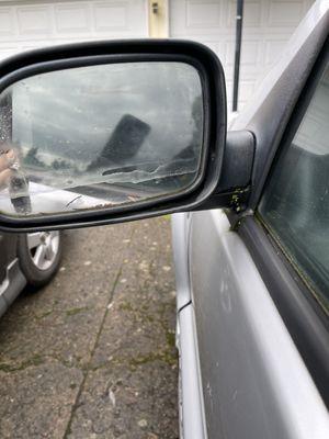 Side mirror destroyed. It was not like this when I dropped it off.