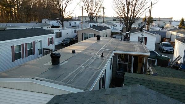 Welch Roofing installing a rubber roof on our mobile  in East Hartford ct