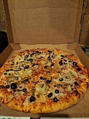 Large veggie pizza with sauce added.