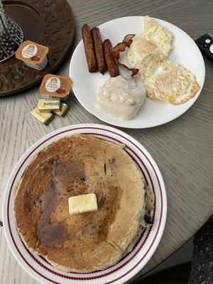 GINORMOUS dinner plate-sized blueberry pancakes, links, biscuit & gravy, eggs over medium.  Oh - and a piece of hubby's bacon. Wow. 060824