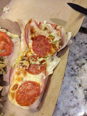 Three small pepperoni on a club hoagie.