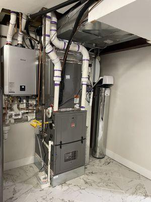 Tankless Water Heater, Furnace & AC condenser (AC unit is outside), UV air scrubber, Humidifier, & Halo5 Water Filtration System