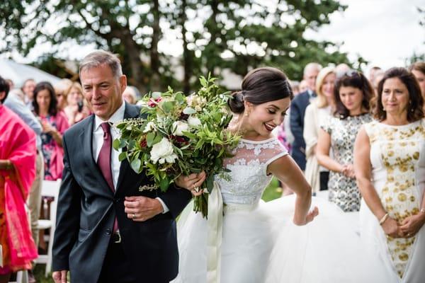 I collected flowers from some beloved women as I walked down the aisle, so my enormous, amazing bouquet is actually several mini bouquets