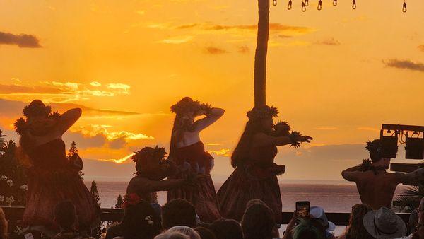 Hula dancers; sunset view.