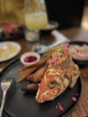 Red snapper with plantain pickled vegetables (Ayiti style) iykyk and red beans and rice. Absolutely delicious!