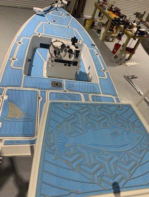 One of our many OceanGrip jobs done in a light blue with a custom pattern including our Nauti Marine Services logo on the bow hatch.