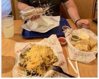 My hefty Burrito, my wife's Nachos with extra cheese, Chips and Queso with salsa.