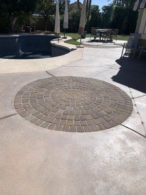 Pavers filled where an old fountain was installed.