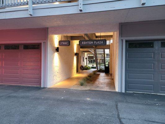 To find the stairs that lead up to his office the quickest, look for this easy to miss walkway when you're in the parking lot