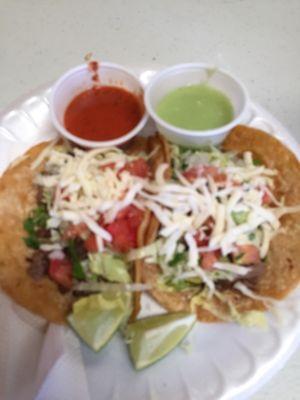 Tacos with lettuce tomato onion cilantro cheese!