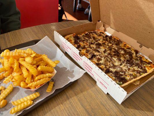 Fries and steak and cheese pizza :)