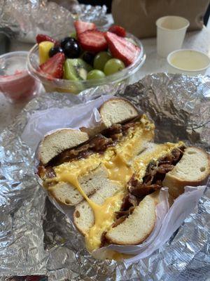 Egg cheese and bacon on plain + side of fruit