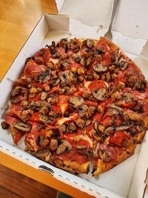 Pizza, pepperoni, sausage and mushrooms.