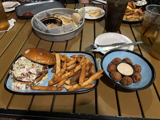 Ahi tuna burger with mango coleslaw, fries and hushpuppies  it was delicious