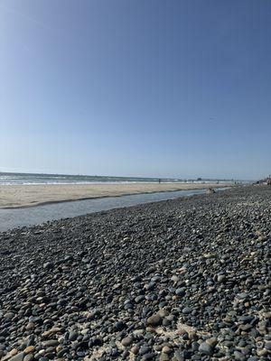 Right side low tide with a pool and flat sand