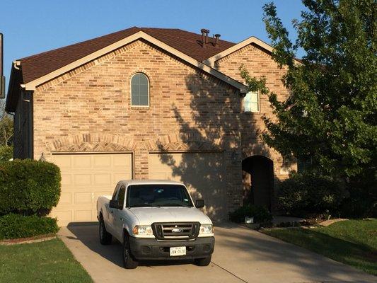 Roofing work completed in the same day. Hickory shingles looks good in this clear bricks.