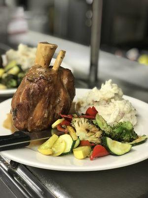 Signature pork Osso Bucco (pork shank) with garlic mashed potatoes and Tuscan blend sautéed vegetables.