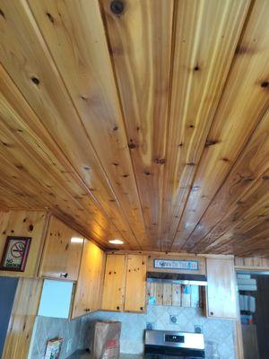 Installation of knotty cedar tongue and groove ceiling