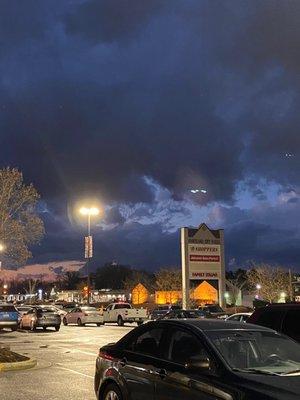 I swear this looks like a ghost above the shoppers sign