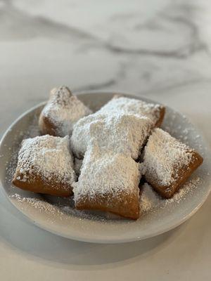 Traditional beignets.Flakey and fluffy.