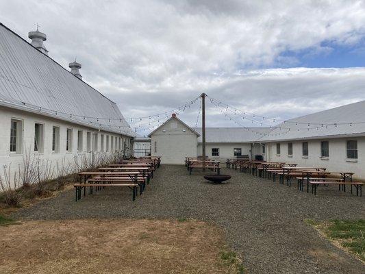 Very German looking beer garden in courtyard between old cow sheds