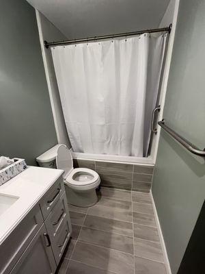 After picture of new bathroom with tile tub enclosure