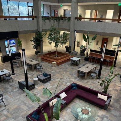 Atrium with televisions and ample seating allowing for social distancing.