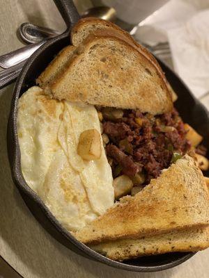 Corned Beef Hash with a side of Rye Bread and 2 eggs over easy.