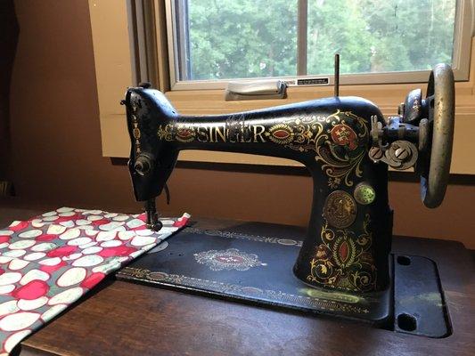 A vintage sewing machine at the treetop