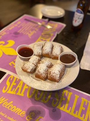 Beignets with raspberry and chocolate sauces