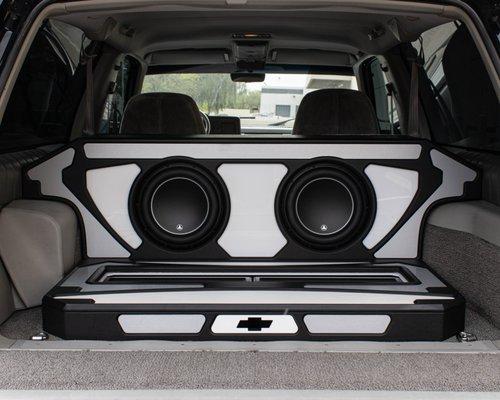 Custom designed & fabricated subwoofer enclosure and amp platform.