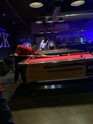 Dudes shooting pool