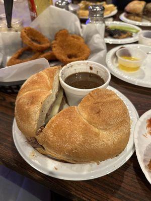 Beef sandwich on a Kaiser roll- onion rings (minus a few I already ate lol) and the butter you can see from the fried mushrooms we had!