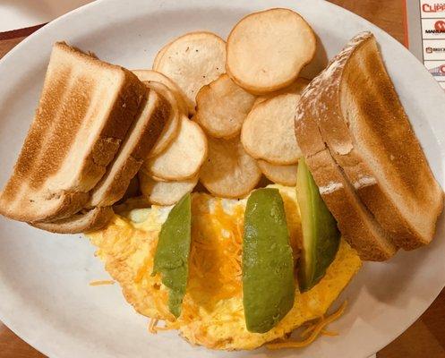 Spinach and cheese omelette with potatoes and sourdough toast