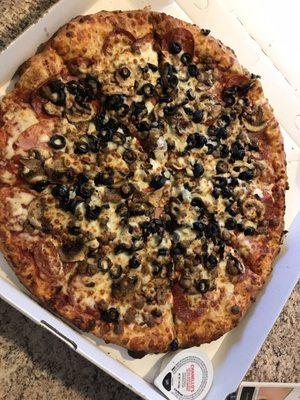 Large meat lovers minus the ground beef. Added mushrooms and olives.