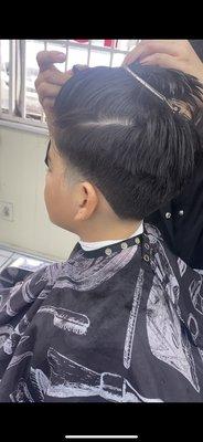 Boys fade haircut.