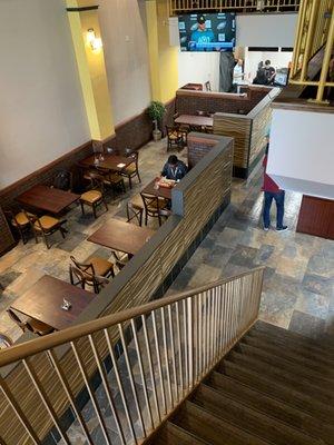 Looking down at the dining area from the second floor.