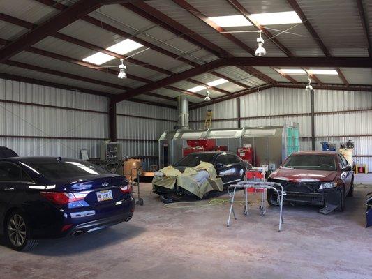 Here is the inside of our facility. Our brand new paint booth is also in the back of the photo.