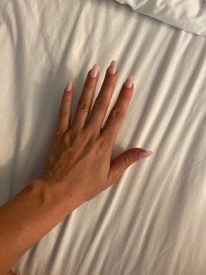 Short pink, coffin shape nails.