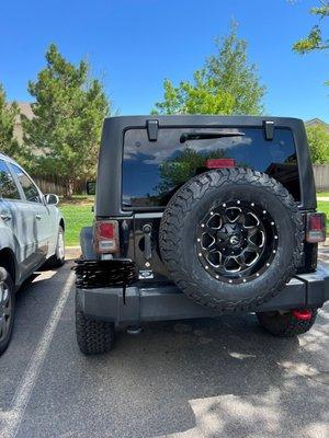 New wheel and tire as well as the washed car.