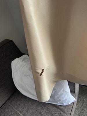 Burn hole in curtain