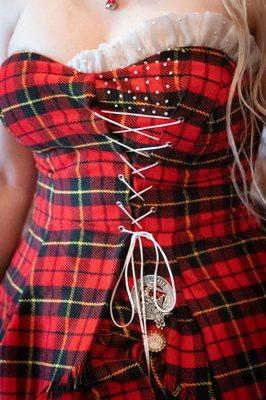 I came with a mess of loose-fitting tartan. She gave me a waist and made it look amazing.