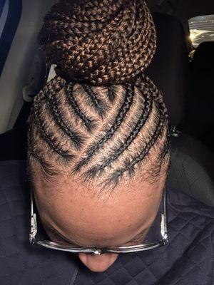 Medium Tribal Box Braids pinned up on top of the head. Top view. Styled by Trey at Trey-Von Salon.