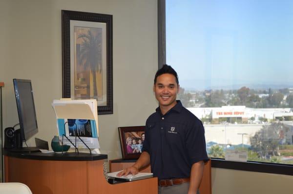 Dr. Llantada in his office,