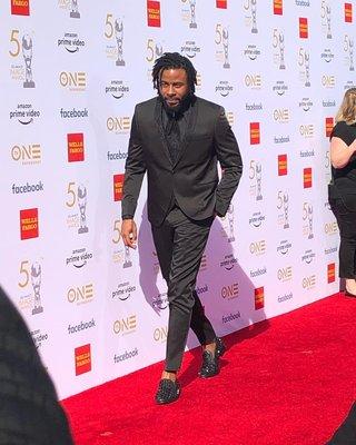 Music artist Sage Gemini sporting our signature tuxedo- at the 50th NAACP Awards. OMC Formal from head to toe actually!